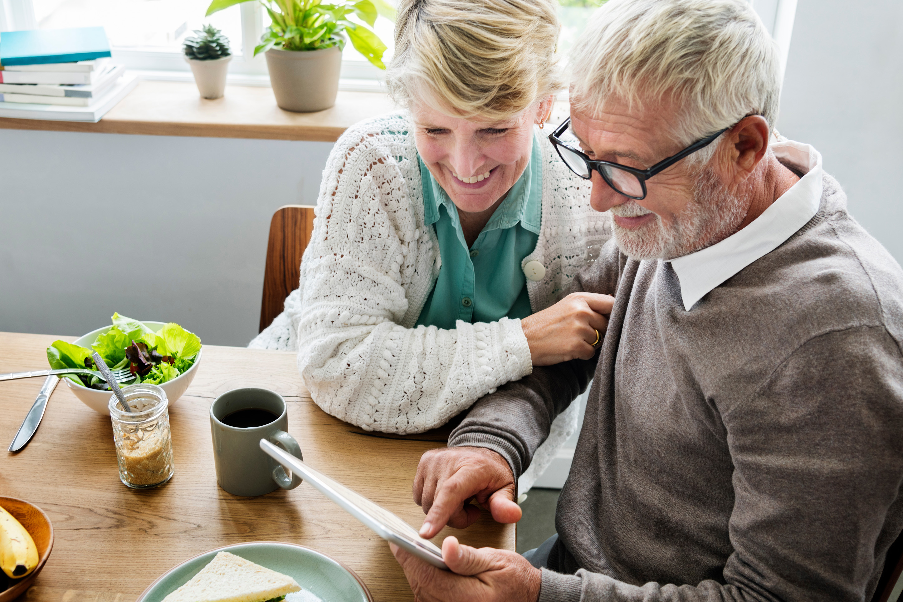 Older couple looking at their mobile banking