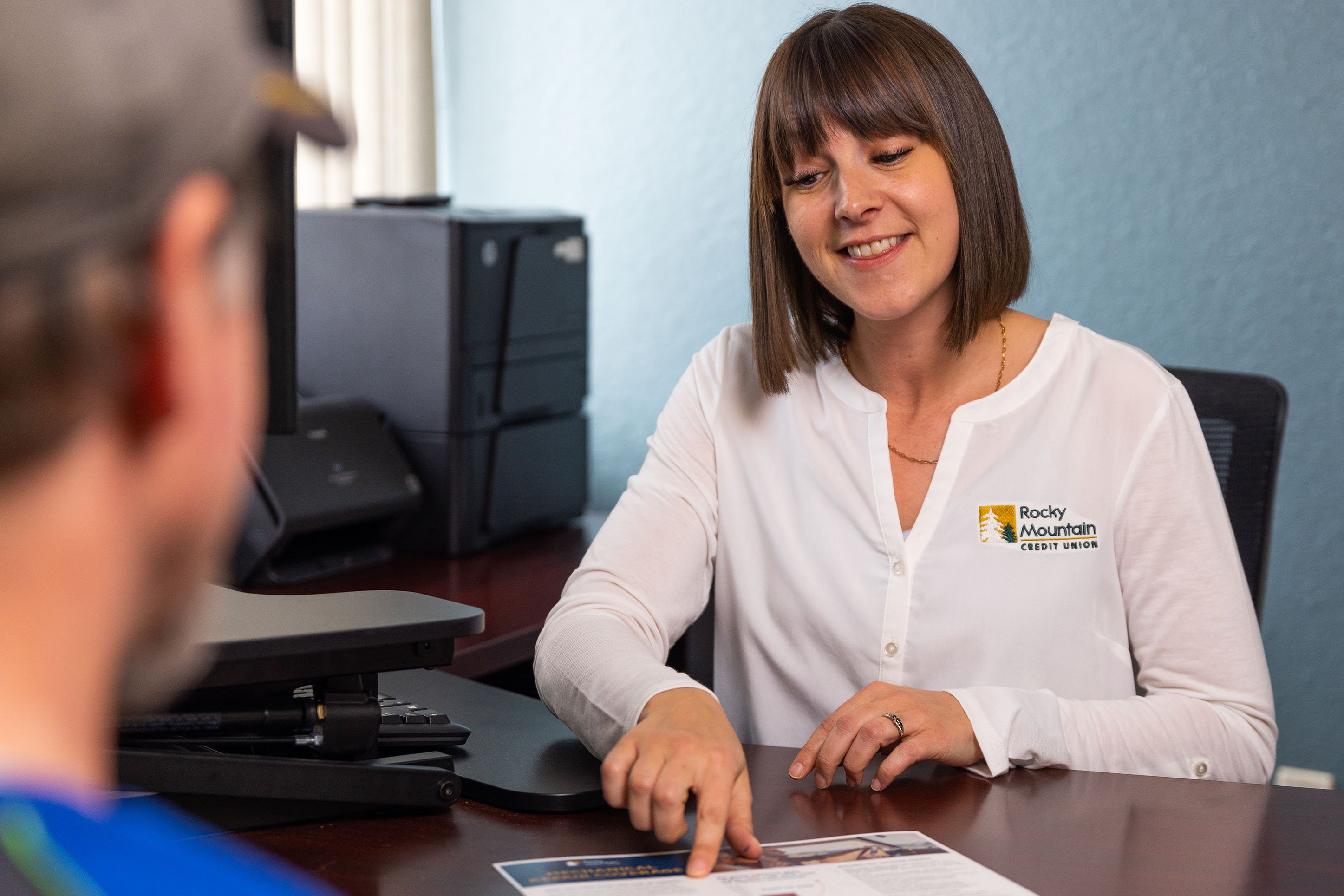 Lender at Rocky Mountain Credit Union working with a client.