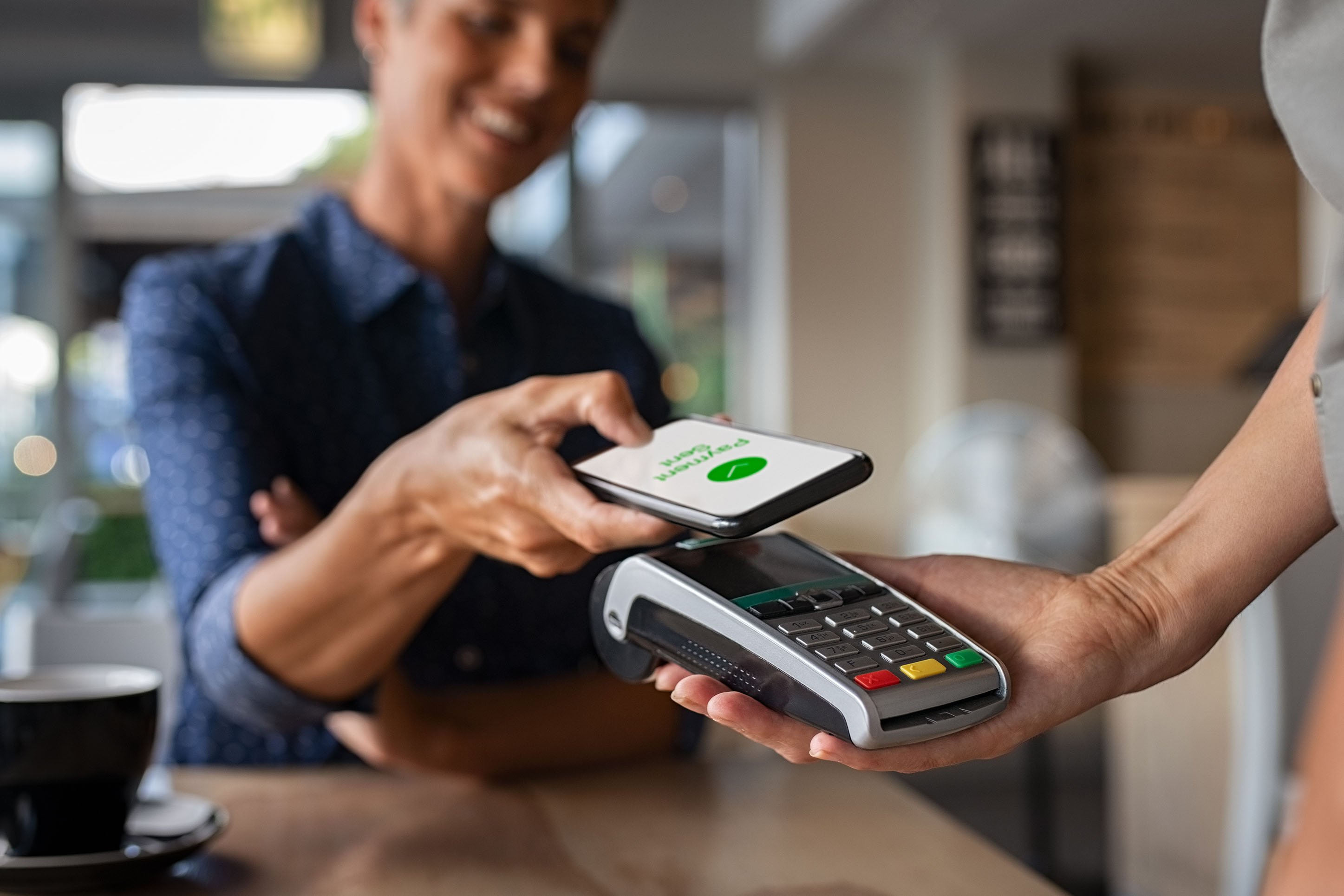 Person paying with a mobile app