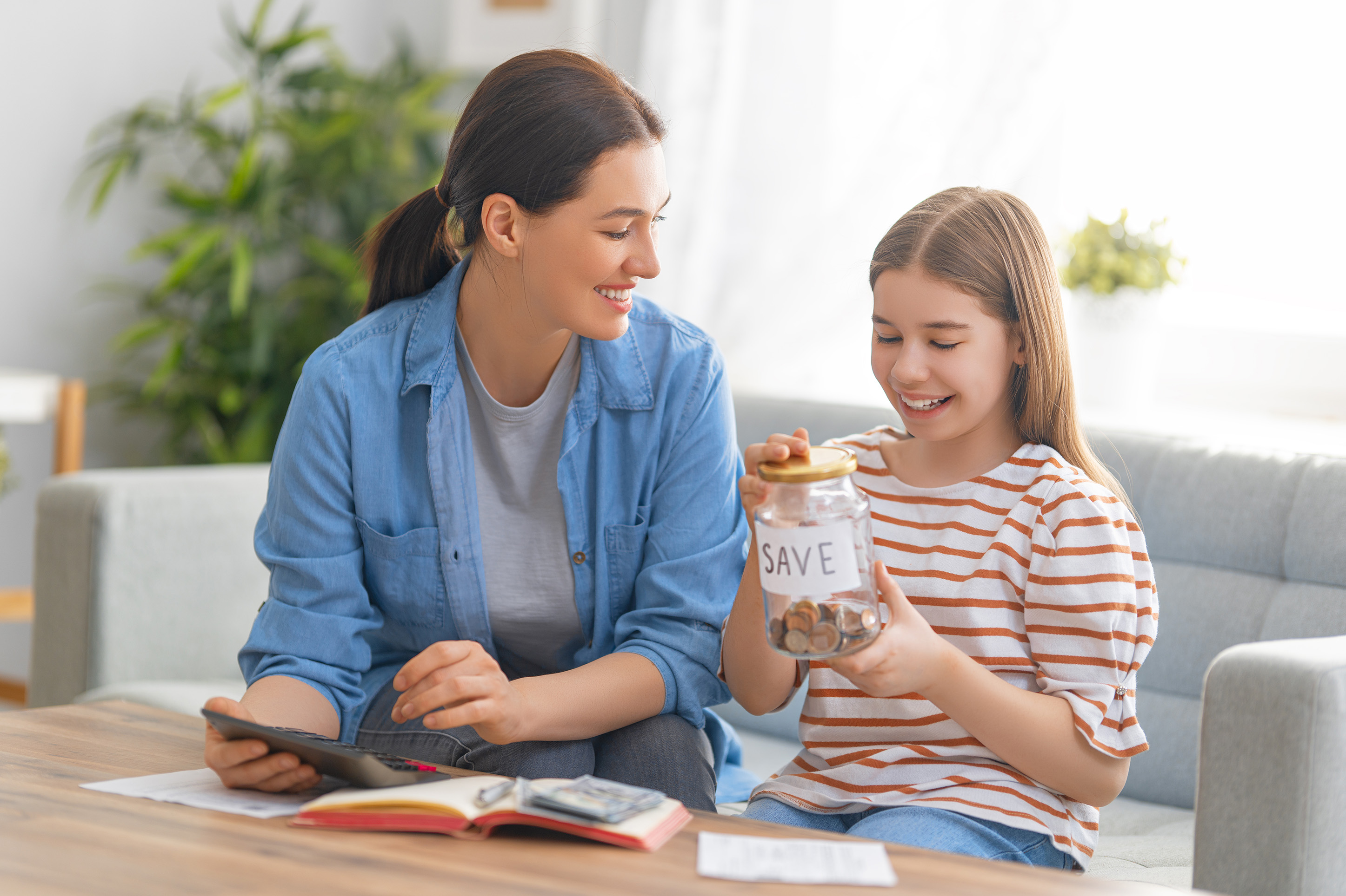 Mother and daughter discussing saving money