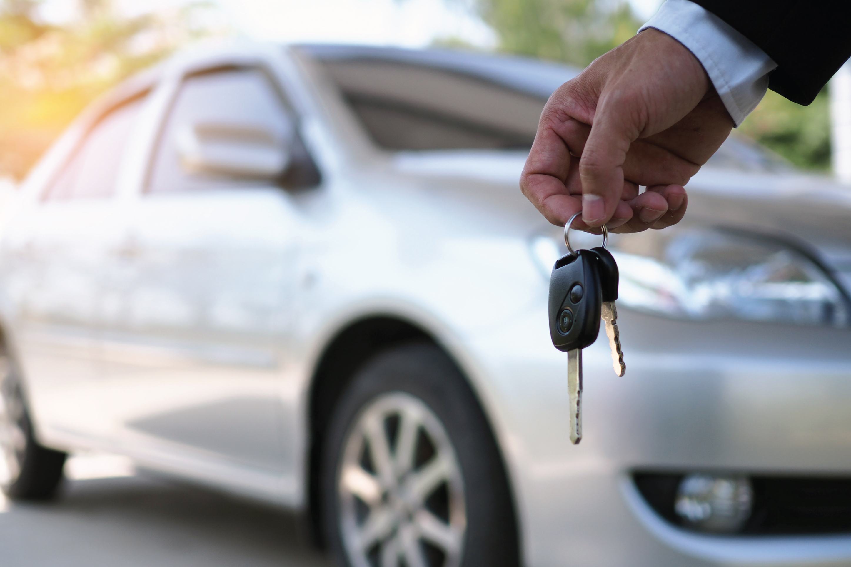 holding the keys to a car