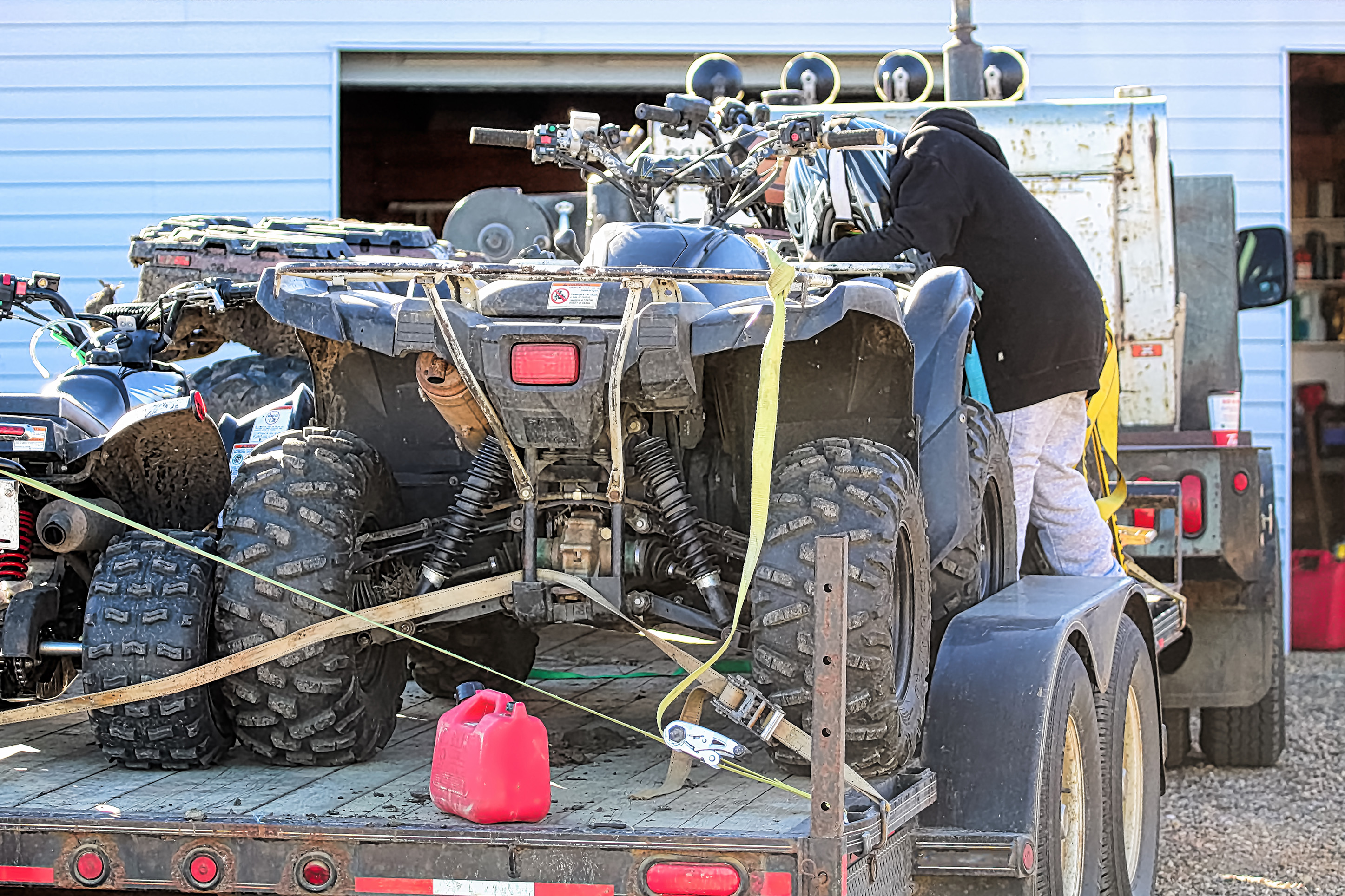 ATVs on a trailer getting ready to go