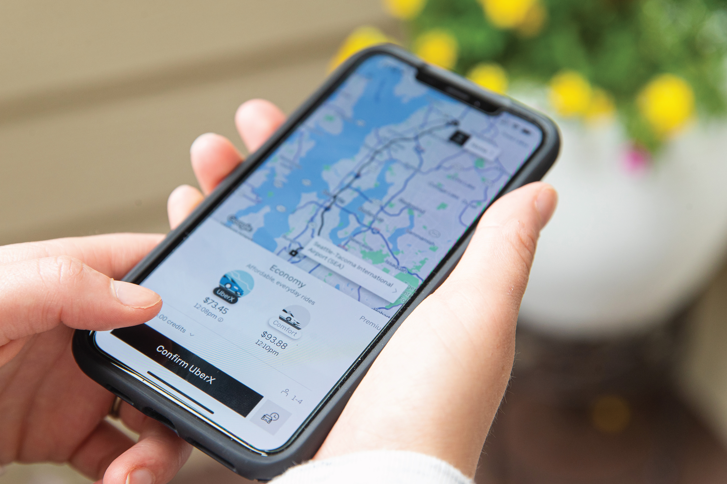 person viewing the uber app on a smartphone