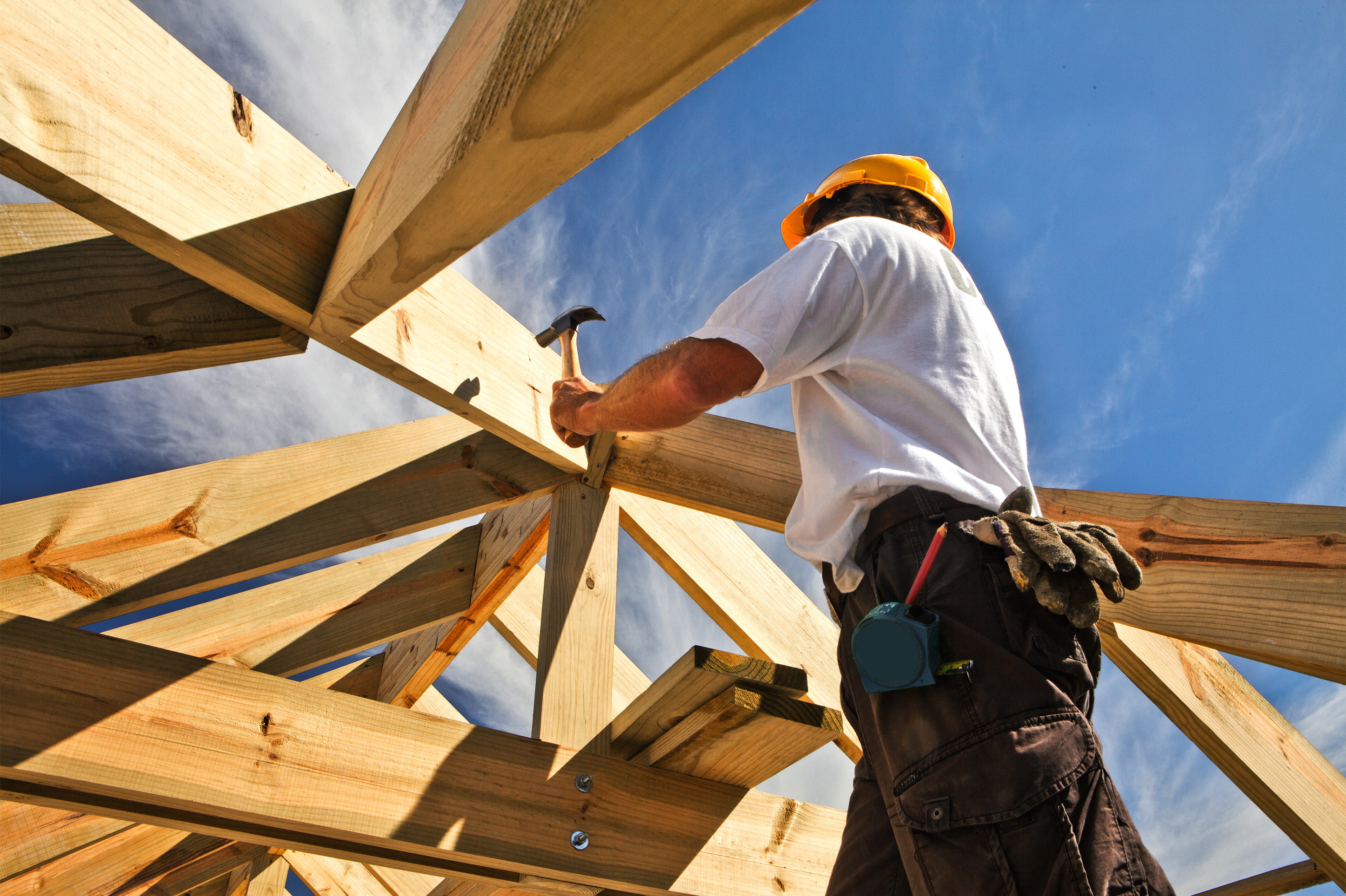 Construction worker building a roof