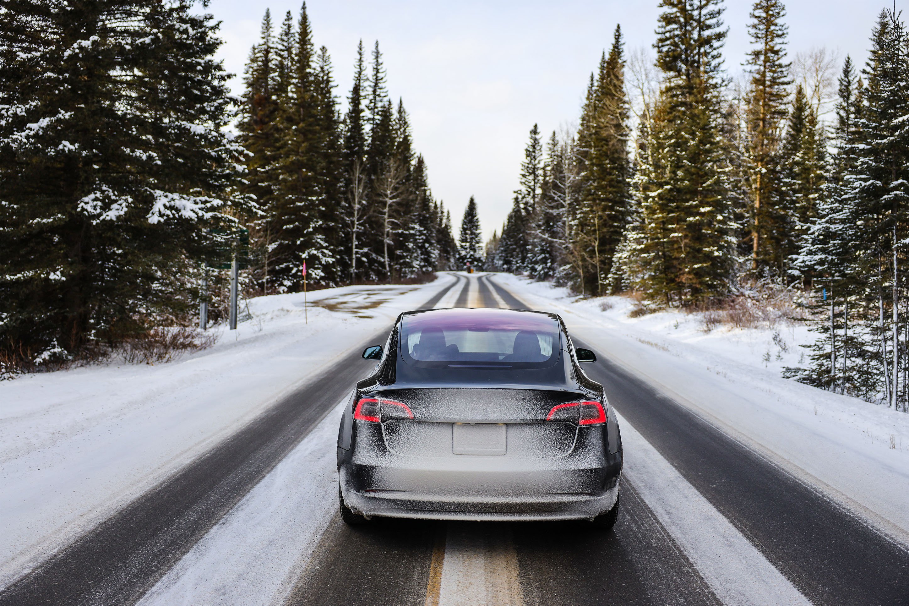Electric vehicle on a snowy road.