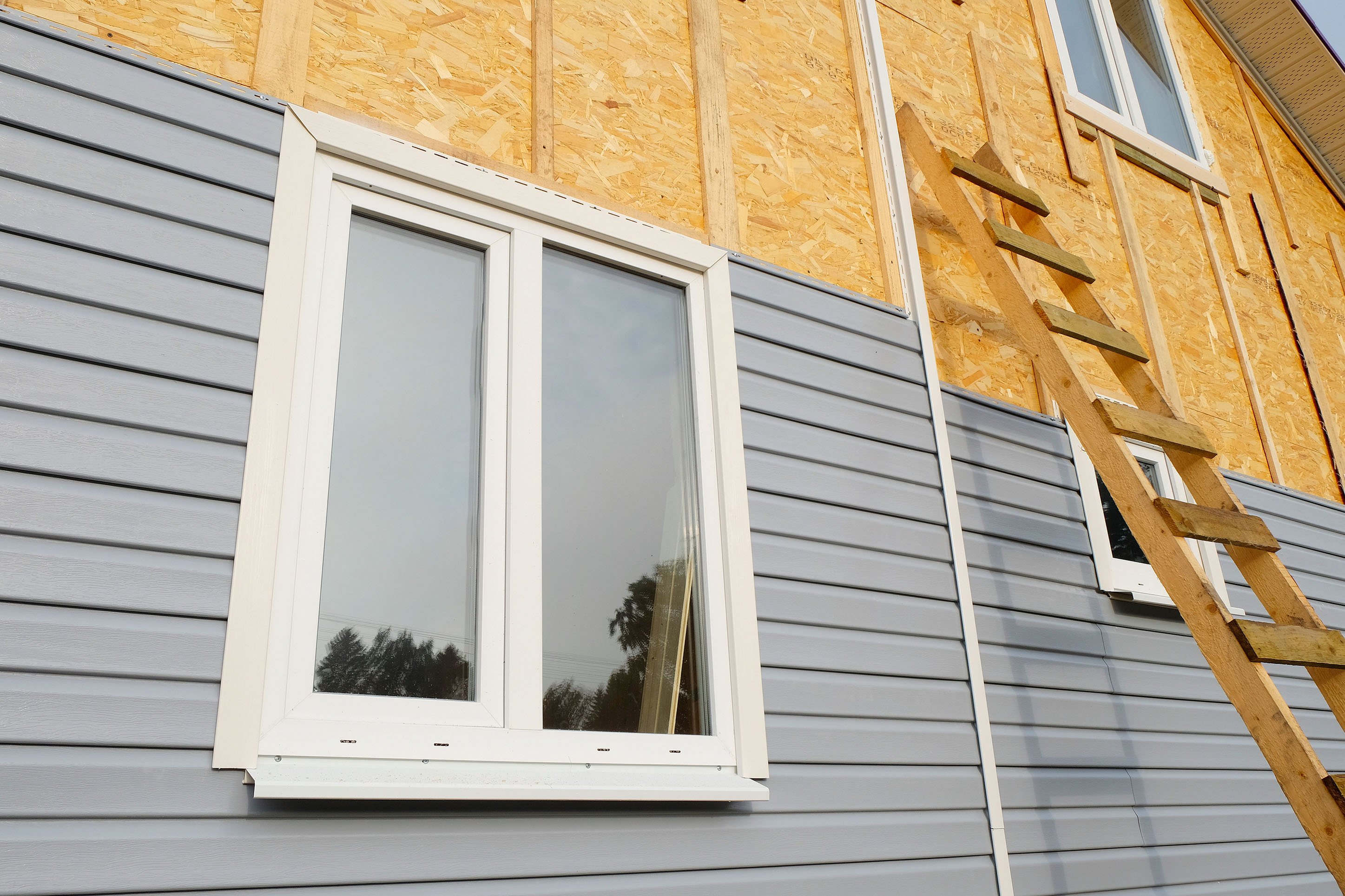 Photo of a home being re-sided.