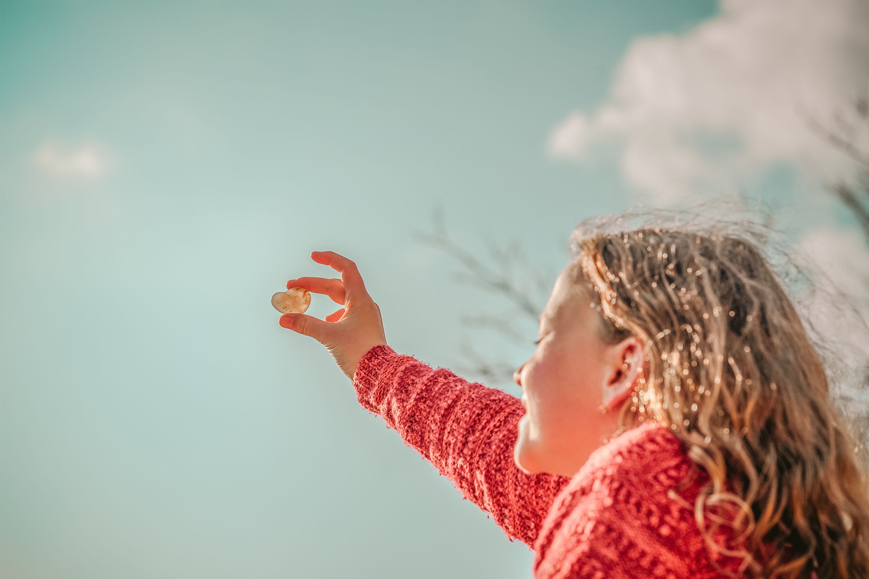 Photo of little girl holding a crystal. 