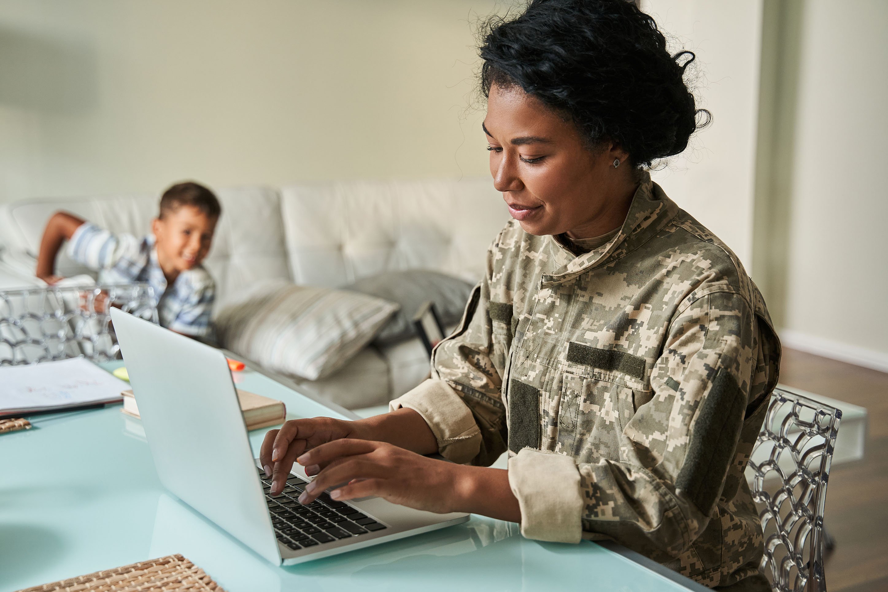 Mom in the Military Working on Computer with Son