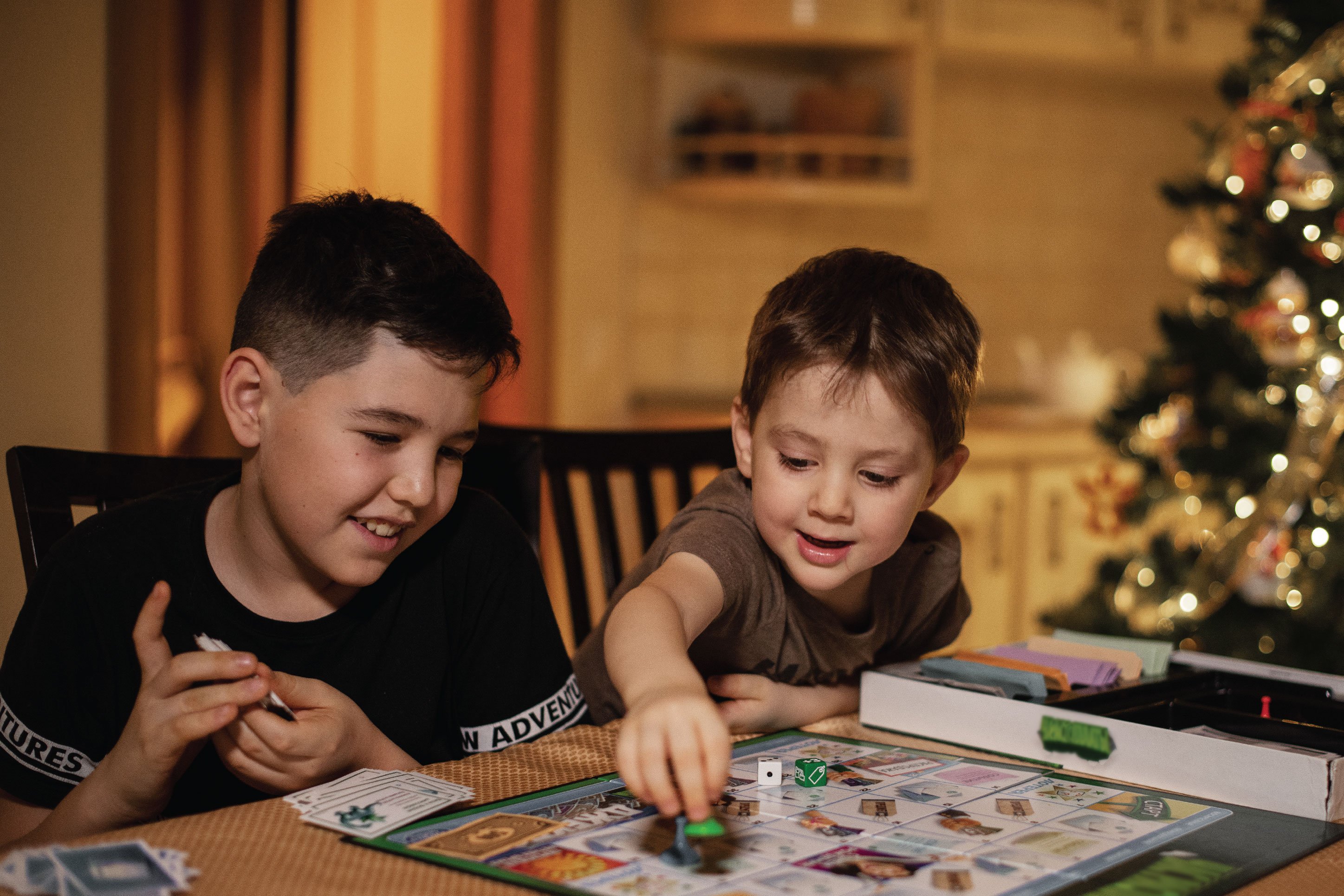 two kids playing a board game