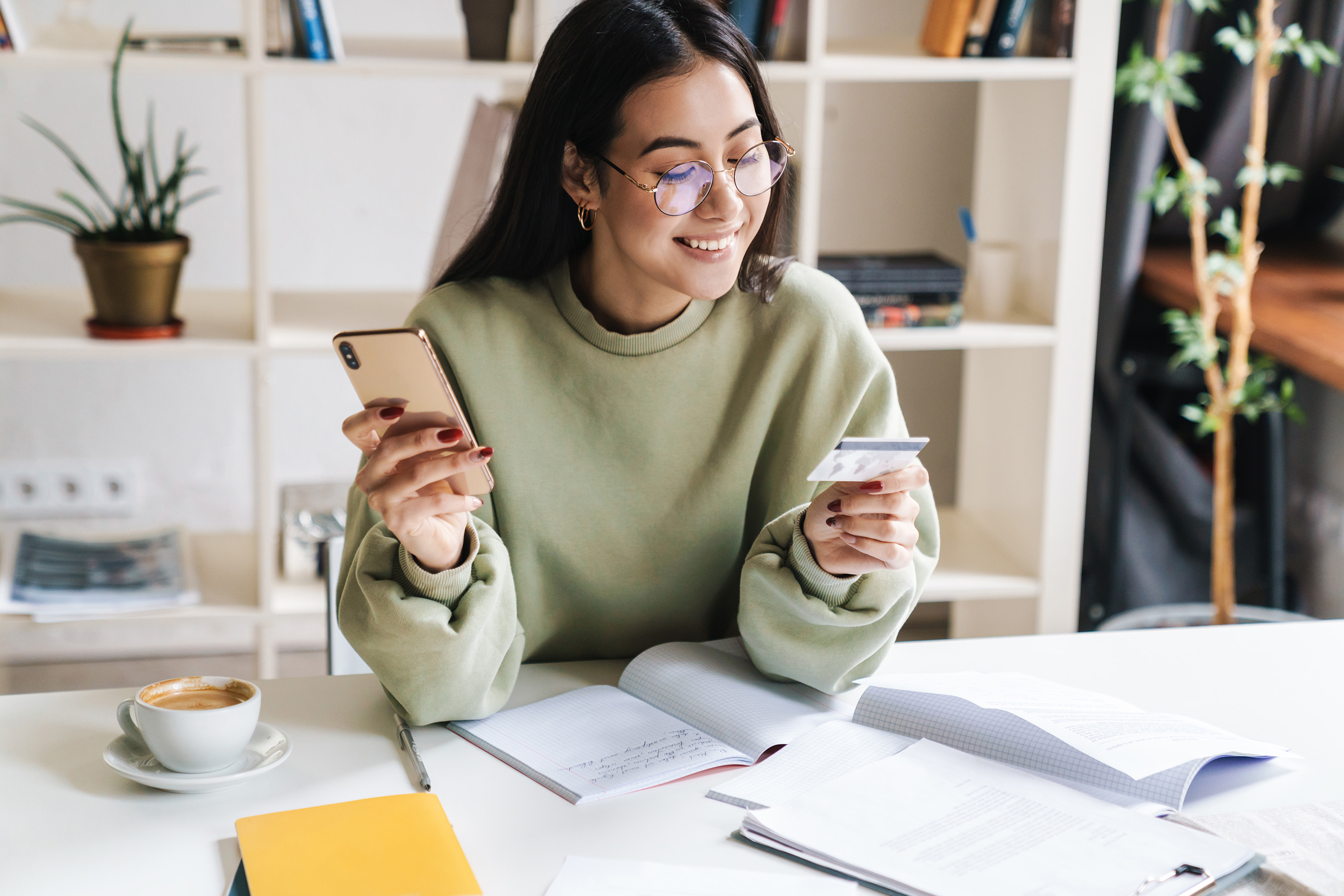 Woman using her credit card online. 