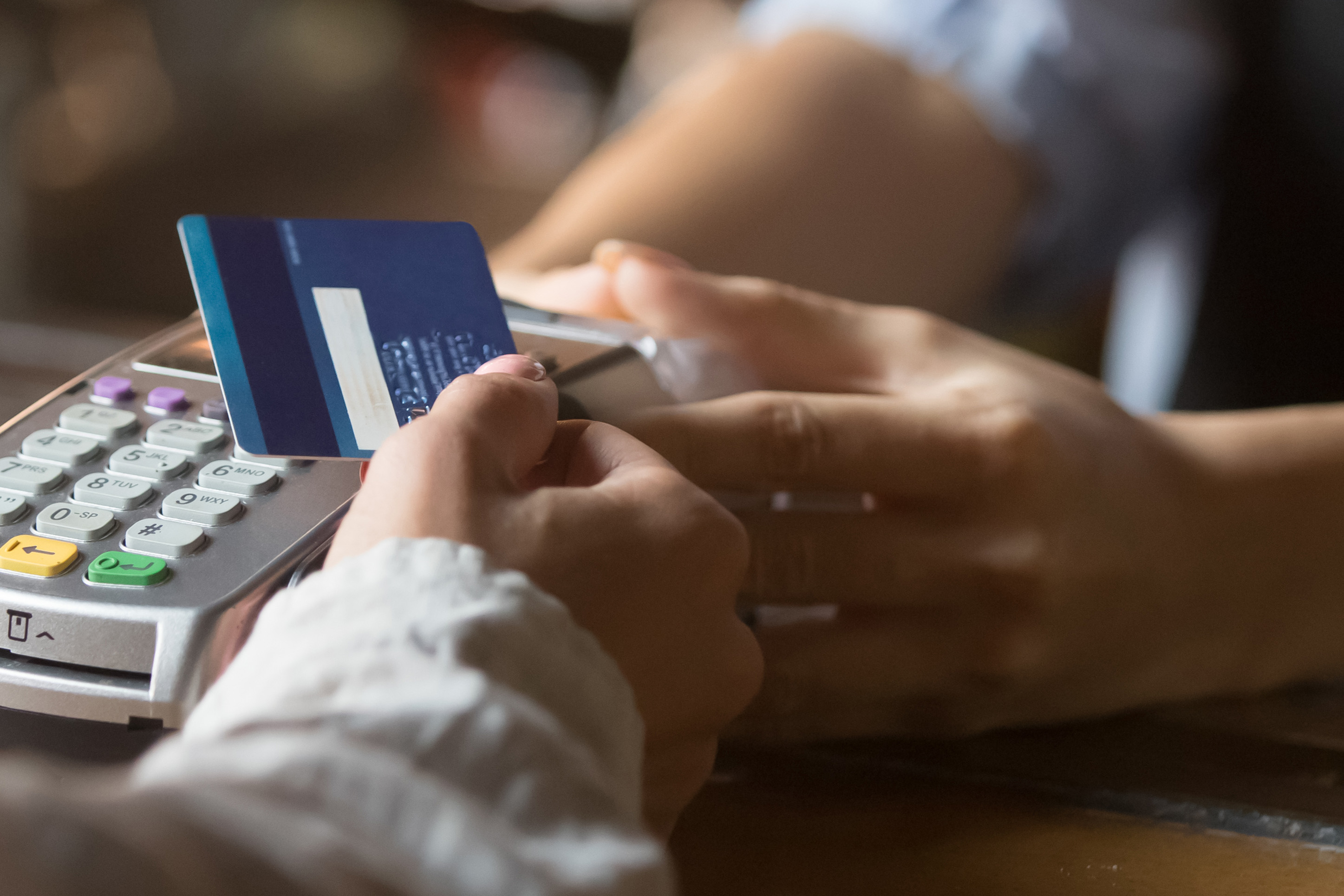 Someone making a purchase with a credit card