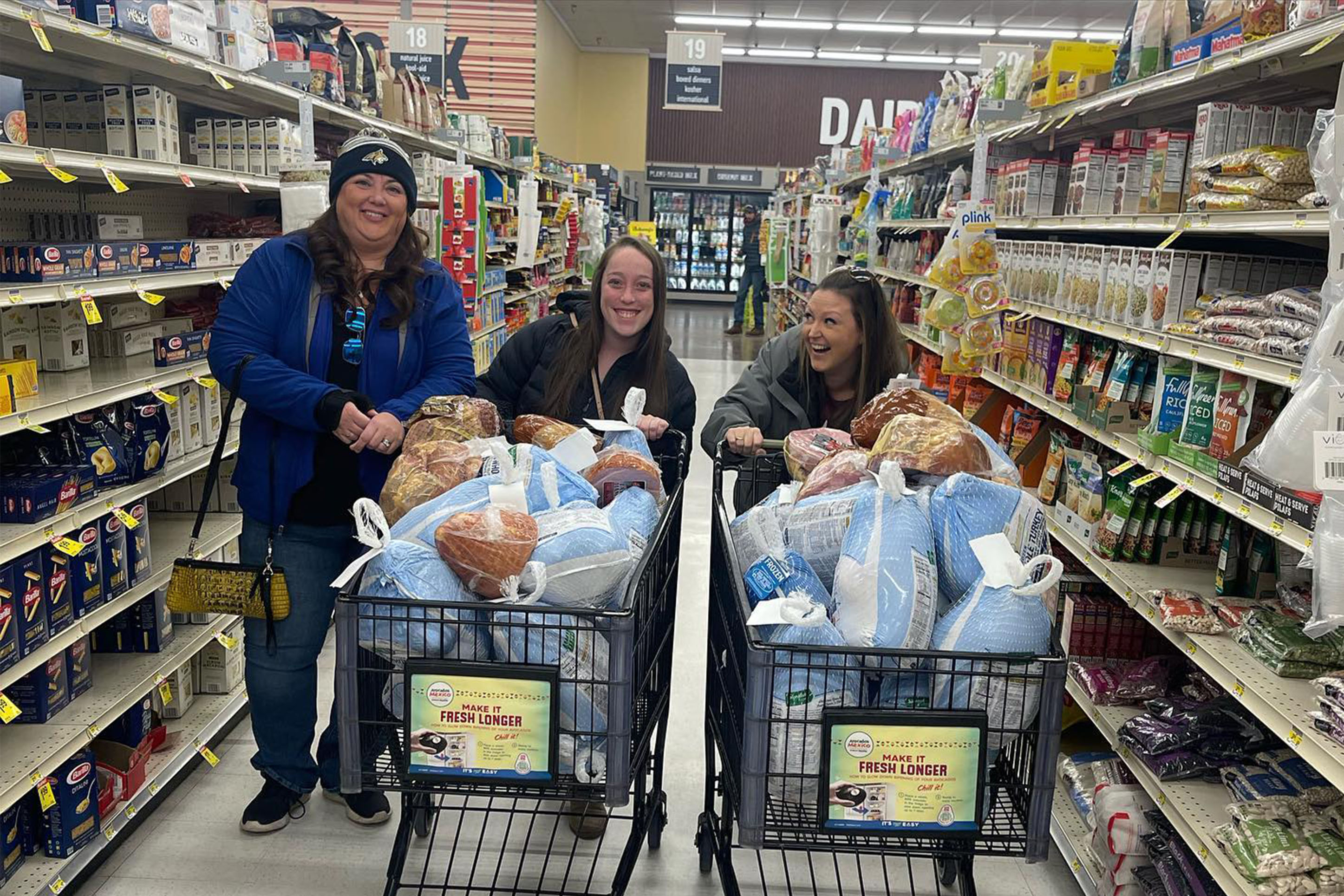 RMCU employees shopping for turkeys to donate. 