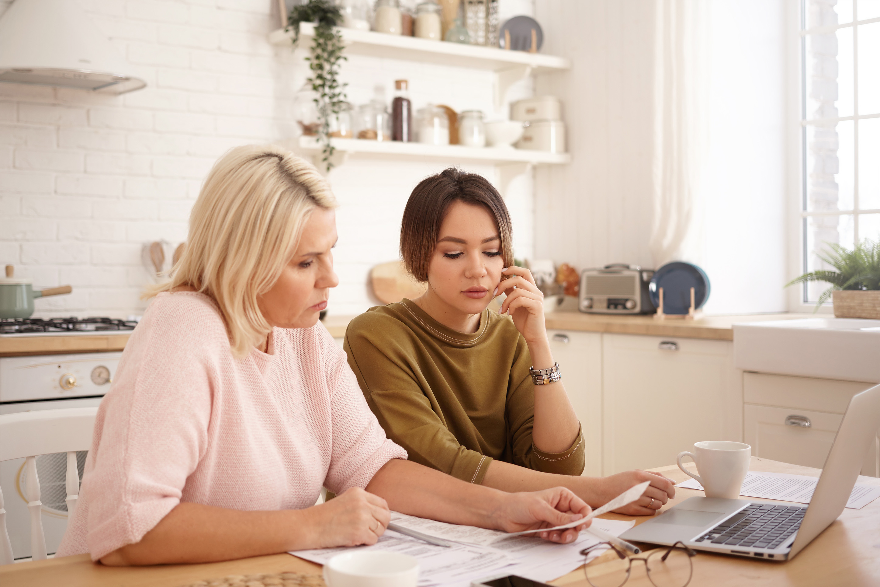 Two women discussing finances. 