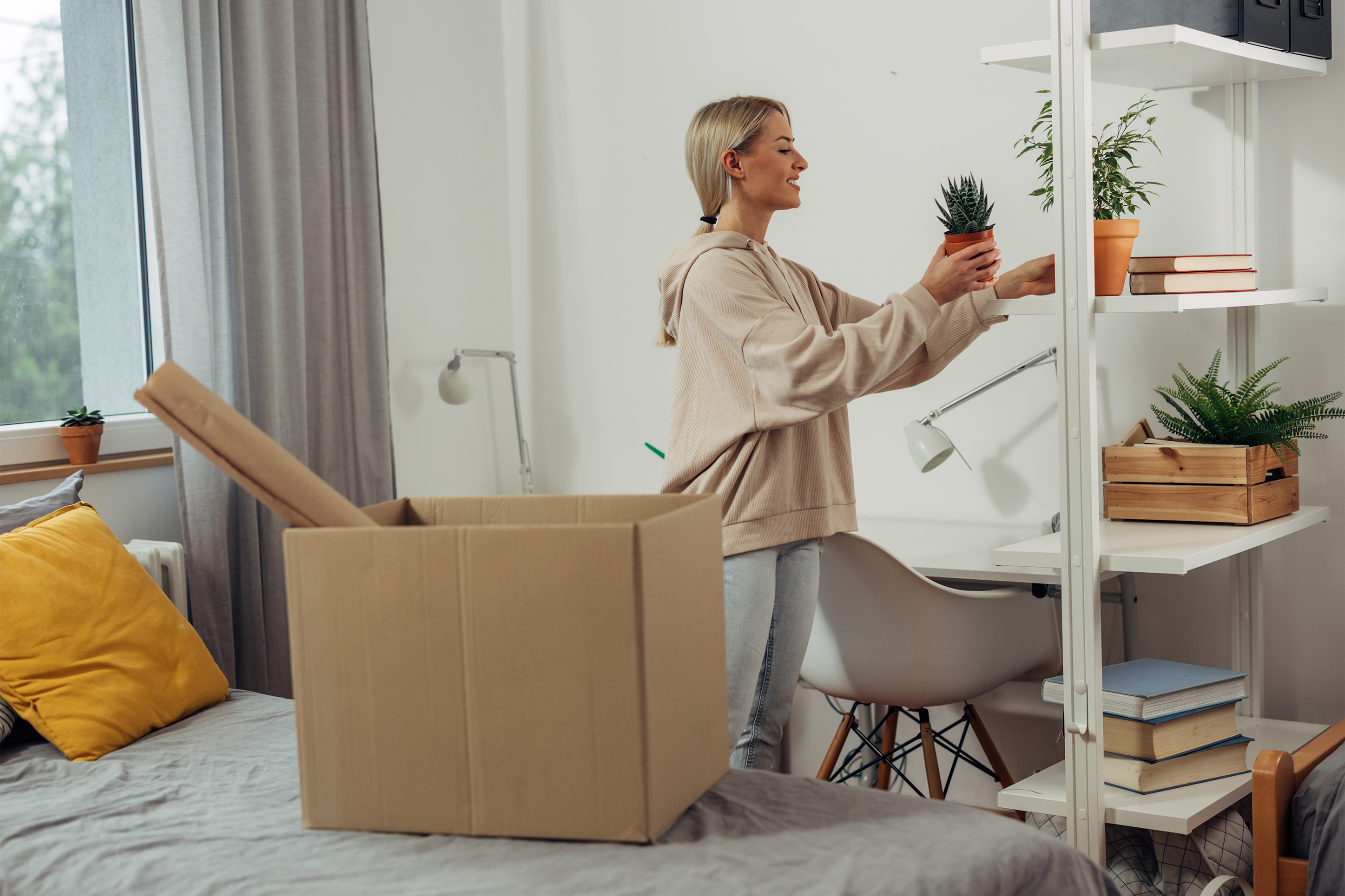 Woman moving into her own home. 
