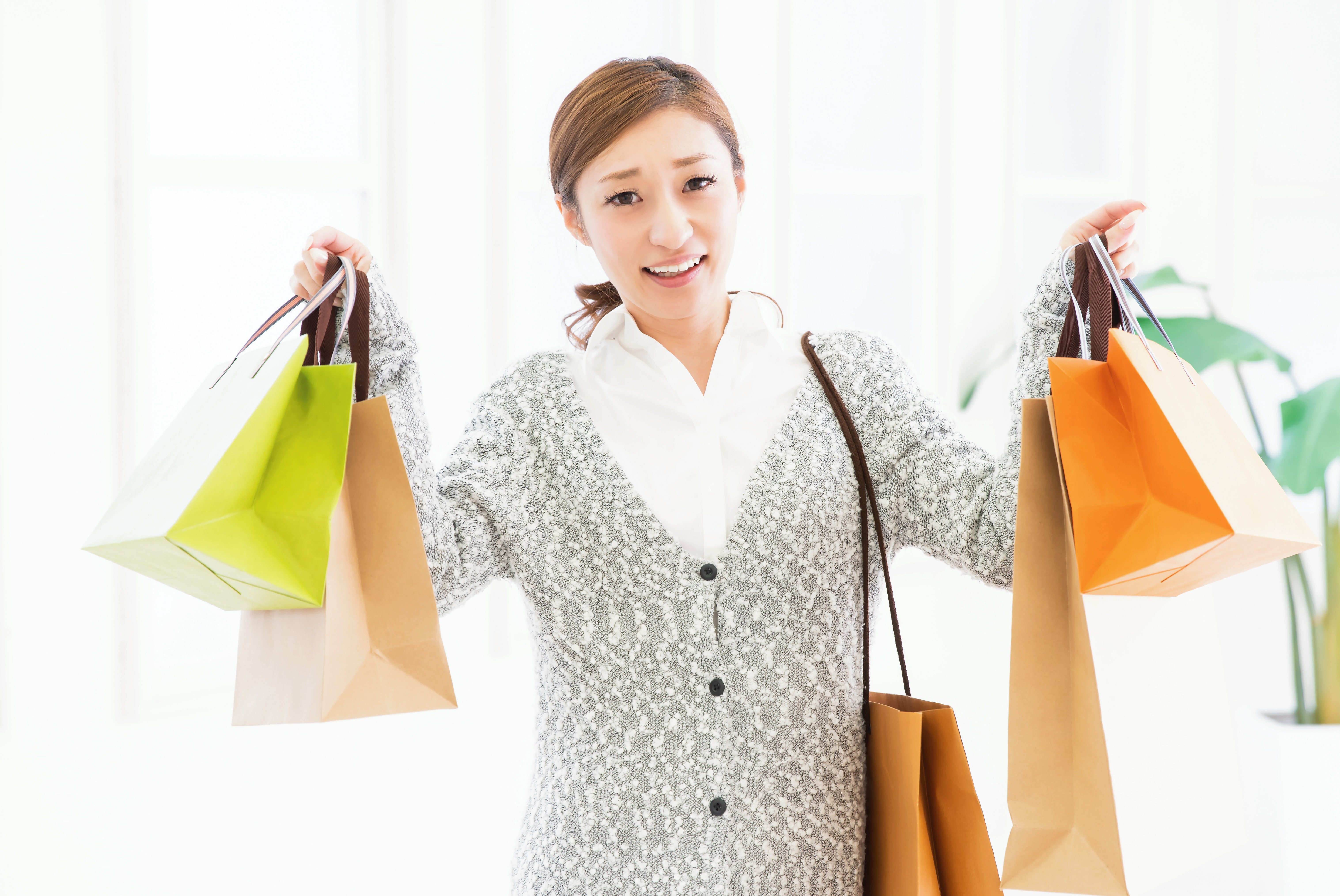 woman with many shopping bags 