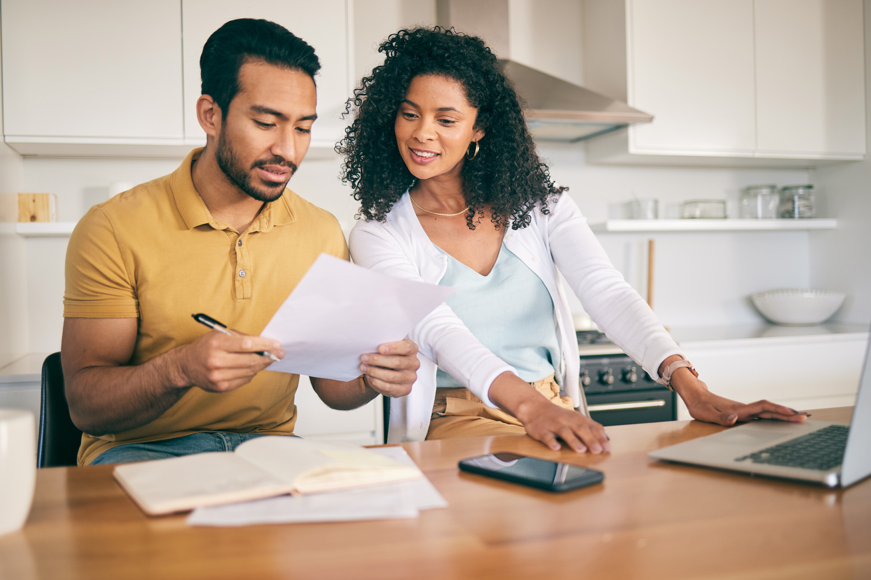 Husband and wife looking at their mortgage.