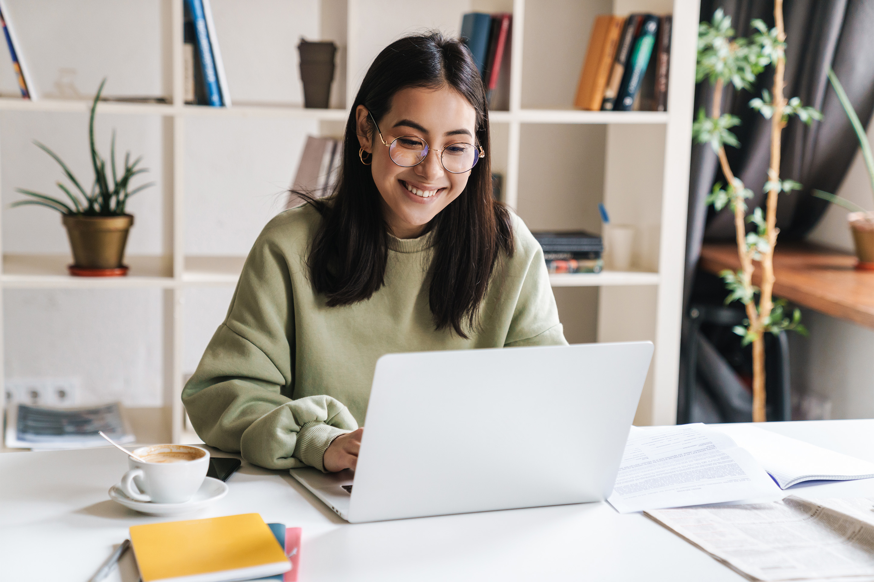 Young woman working on budgeting at her computer