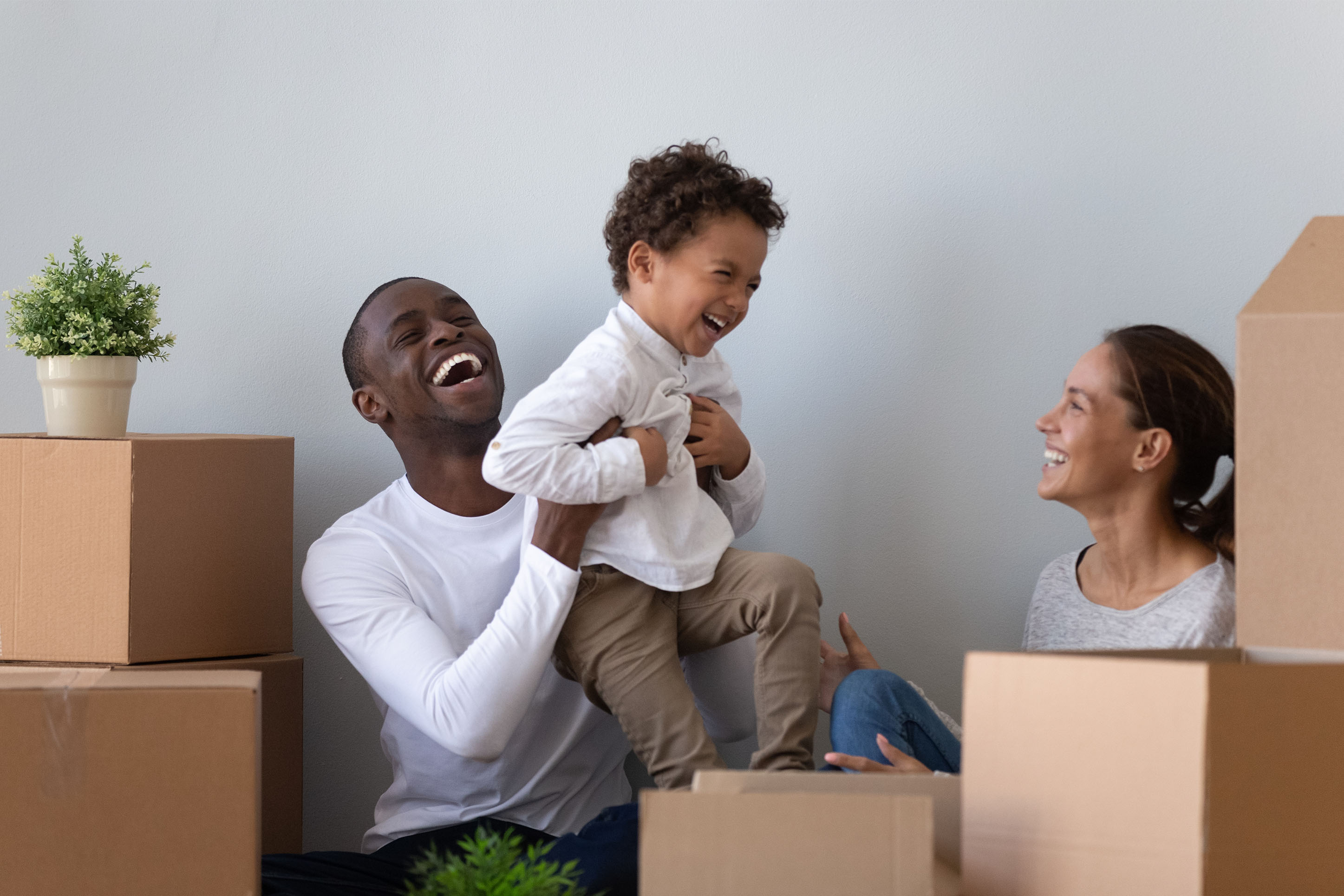 Couple with a young son moving into a new home. 